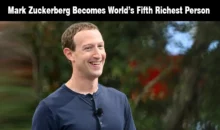 Meta CEO Mark Zuckerberg smiling in front of green foliage.