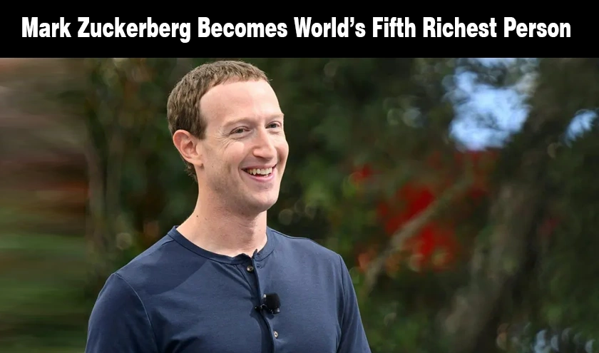 Meta CEO Mark Zuckerberg smiling in front of green foliage.